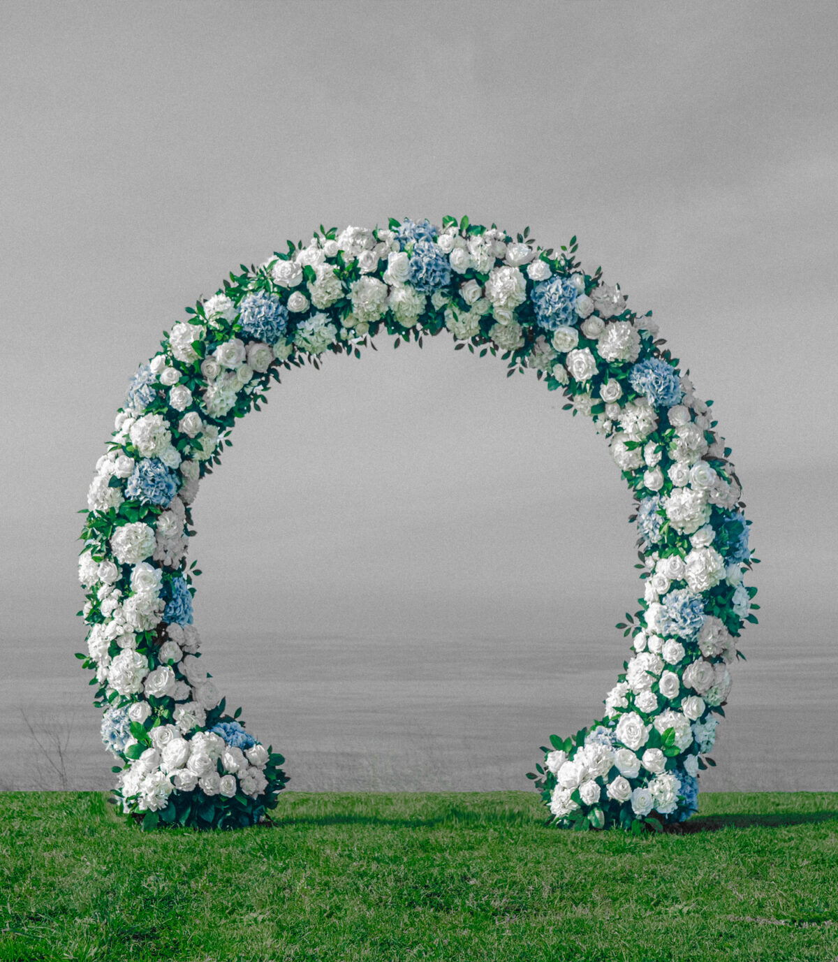 Modern white and blue hydrangea wedding arch with sleek, structured floral arrangements. A chic and sophisticated design, perfect for contemporary venues and rooftop celebrations.