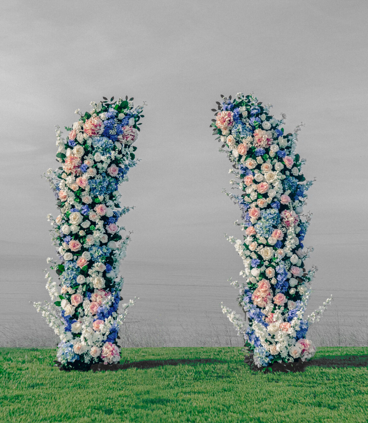 Romantic garden wedding arch inspired by Bridgerton, featuring soft pastel florals and lush greenery. A dreamy, fairytale-like setting for garden and vineyard weddings.